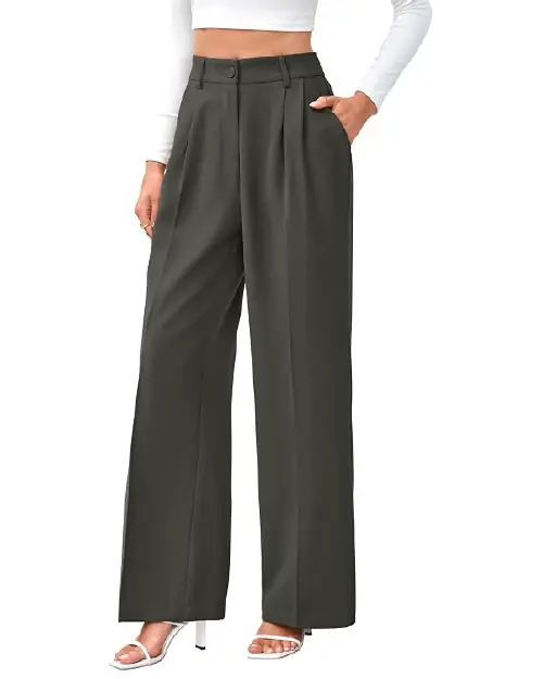 A person wearing dark olive green high-waisted wide-leg work pants for women with front pleats and side pockets, paired with white heels.